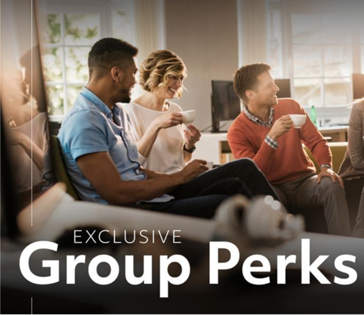 People sitting down, drinking coffee, and laughing. There is a text overlay that says, "Exclusive Group Perks."